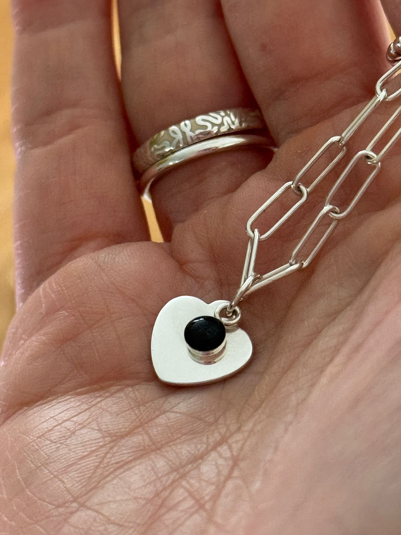 Silver Heart Necklace on Hand